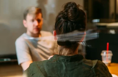 A man engaged in a counselling session, reflecting the person-centred approach provided by Lynn Guthrie at The Empathic Therapist.